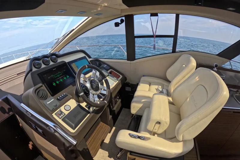 Slide: The Image of Interior cockpit of 2016 Azimut 55S yacht with modern controls and ocean view. - 61