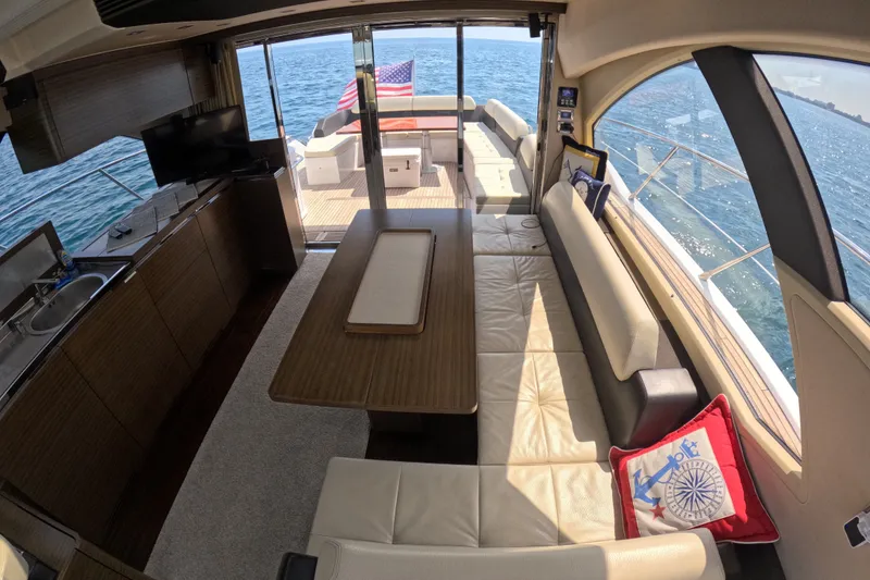 Slide: The Image of Luxurious interior of 2016 Azimut 55S yacht with ocean view and elegant seating area. - 57