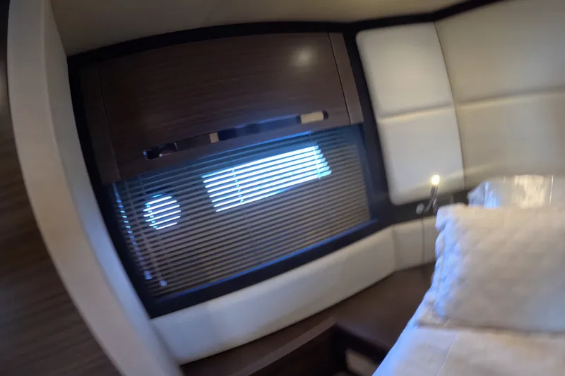 Slide: The Image of Interior cabin of 2016 Azimut 55S yacht with window blinds and plush bedding. - 121