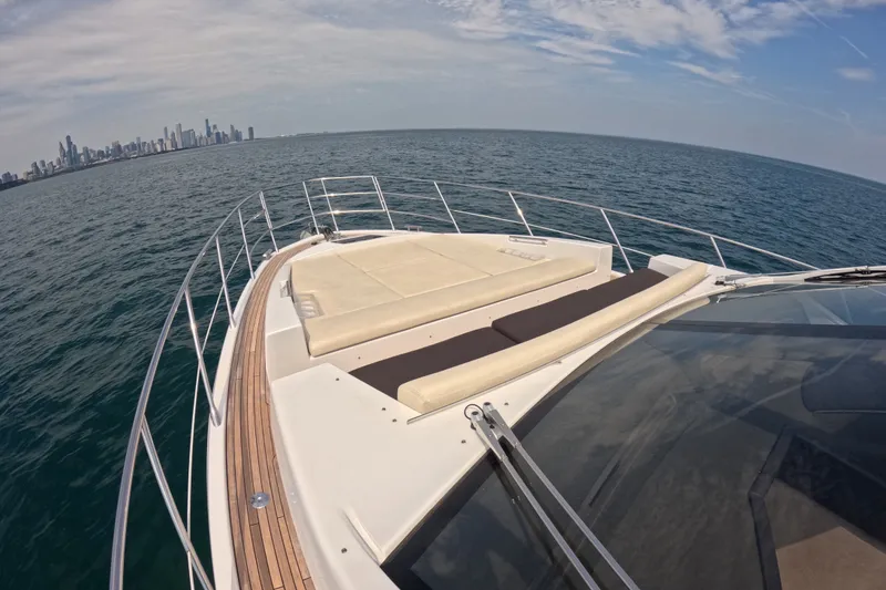 Slide: The Image of 2016 Azimut 55S yacht deck with city skyline in the background. - 20