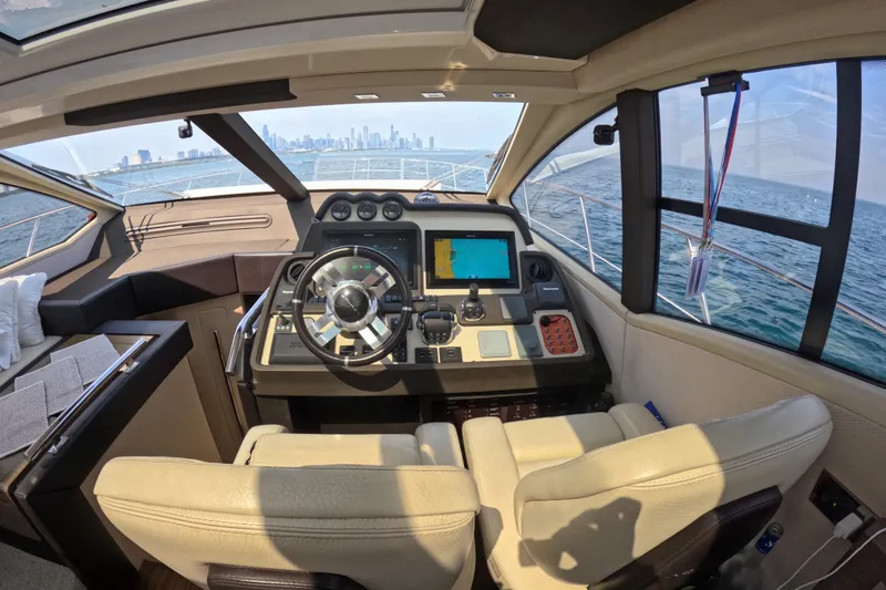 Slide: The Image of Luxurious 2016 Azimut 55S yacht cockpit with modern navigation system and city skyline view. - 60