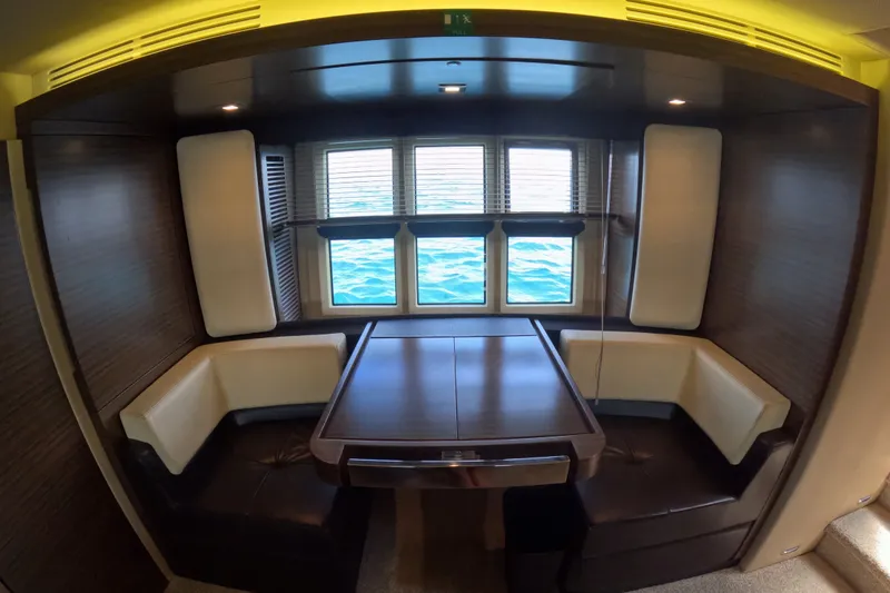 Slide: The Image of Luxurious dining area inside a 2016 Azimut 55S yacht with ocean view. - 90