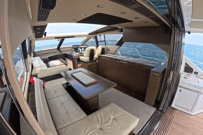Slide: The Image of Luxurious interior of a 2016 Azimut 55S yacht with elegant seating and ocean view. - 40