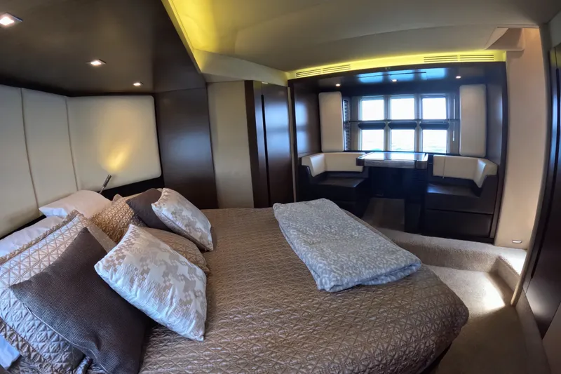Slide: The Image of Luxurious bedroom interior of 2016 Azimut 55S yacht with elegant bedding and seating area. - 86