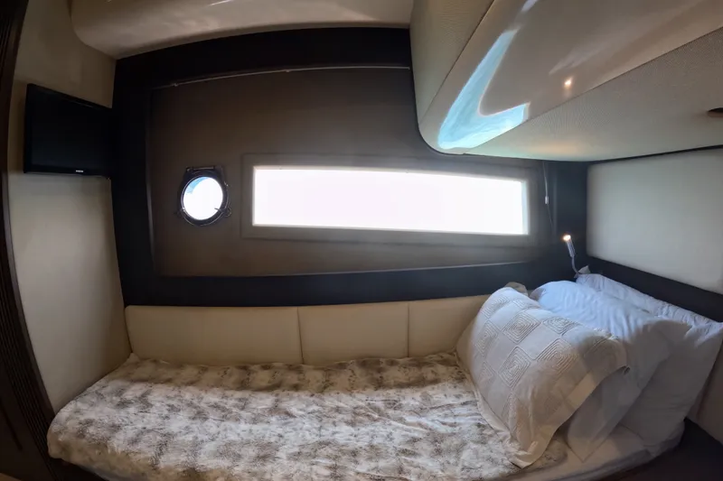 Slide: The Image of Luxurious cabin interior of 2016 Azimut 55S yacht with cozy bedding and porthole window. - 107