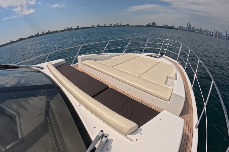 Slide: The Image of Luxurious 2016 Azimut 55S yacht with spacious deck, cruising near city skyline. - 27