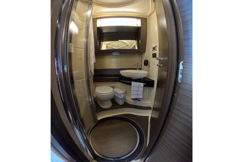 Slide: The Image of Luxurious bathroom interior of 2016 Azimut 55S yacht, featuring modern fixtures and elegant design. - 115