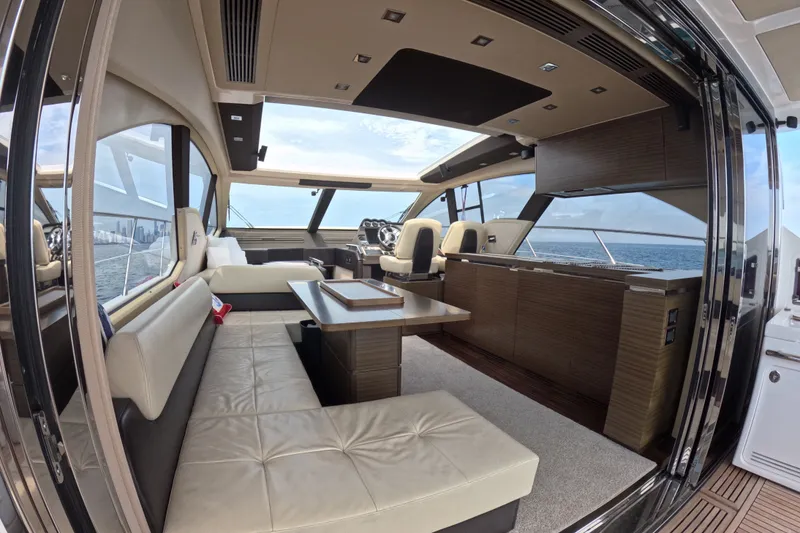 Slide: The Image of Luxurious interior of a 2016 Azimut 55S yacht with elegant seating and ocean view. - 39