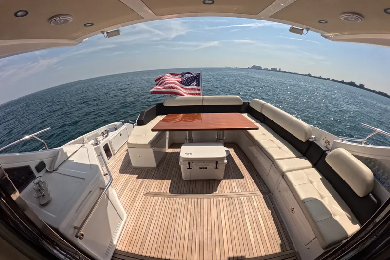 Slide: The Image of Luxurious 2016 Azimut 55S yacht deck with seating, table, and ocean view. - 35