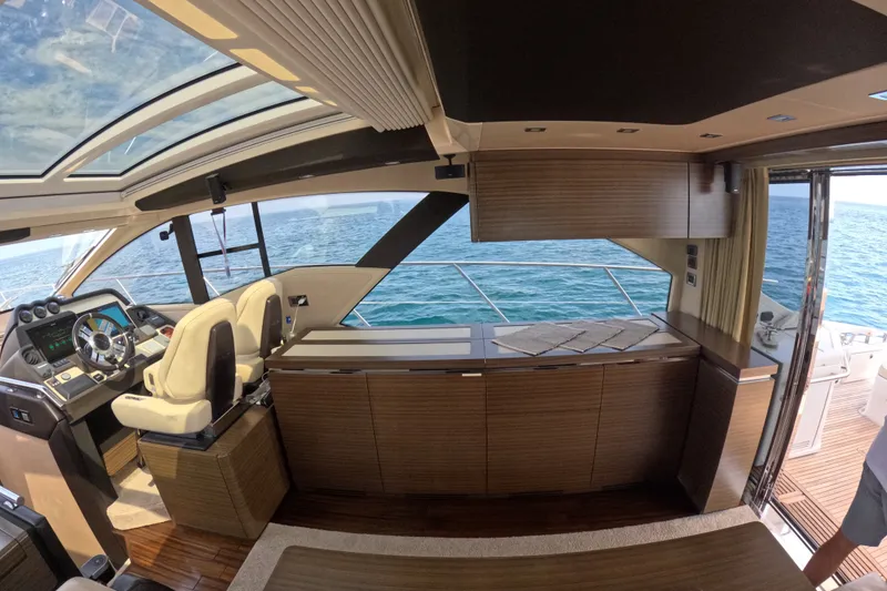 Slide: The Image of Interior of 2016 Azimut 55S yacht with modern helm and ocean view. - 49