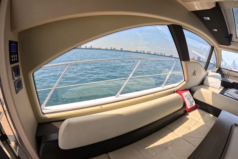 Slide: The Image of Interior view of 2016 Azimut 55S yacht with ocean and city skyline. - 54