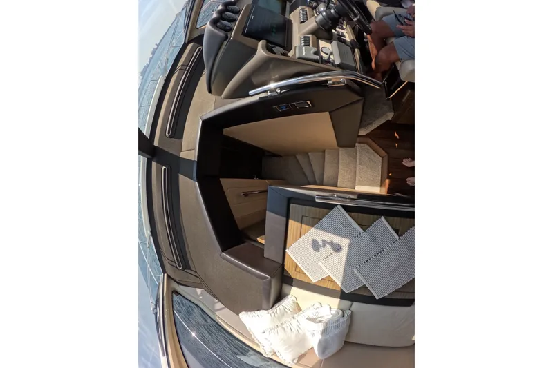 Slide: The Image of Interior view of 2016 Azimut 55S yacht, featuring helm and staircase. - 73