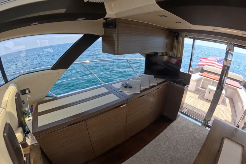 Slide: The Image of Luxurious interior of 2016 Azimut 55S yacht with ocean view and American flag. - 47