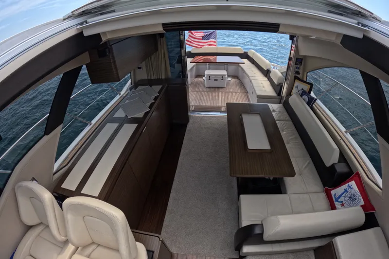 Slide: The Image of Luxurious interior of a 2016 Azimut 55S yacht with elegant seating and ocean view. - 58