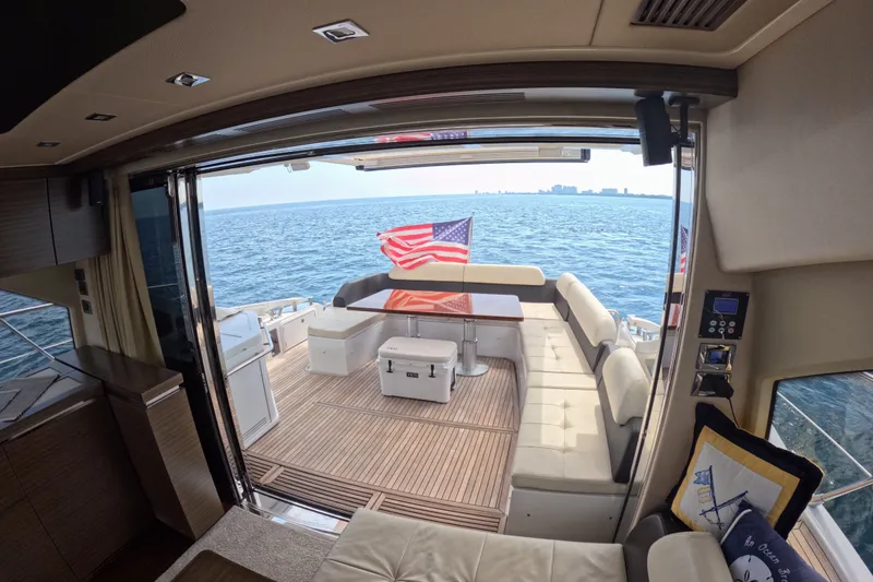 Slide: The Image of Luxurious 2016 Azimut 55S yacht interior with ocean view and American flag. - 37