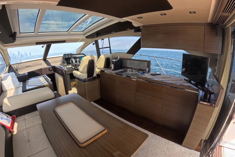 Slide: The Image of Luxurious interior of a 2016 Azimut 55S yacht with modern furnishings and ocean view. - 59