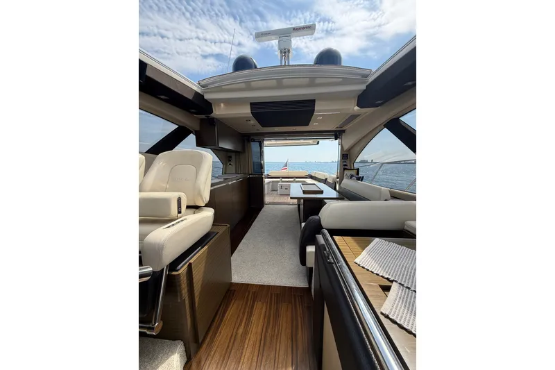Slide: The Image of Luxurious interior of a 2016 Azimut 55S yacht with elegant seating and ocean view. - 72