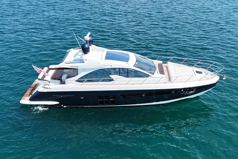 Slide: The Image of 2016 Azimut 55S yacht cruising on open water, showcasing sleek design and luxury features. - 4