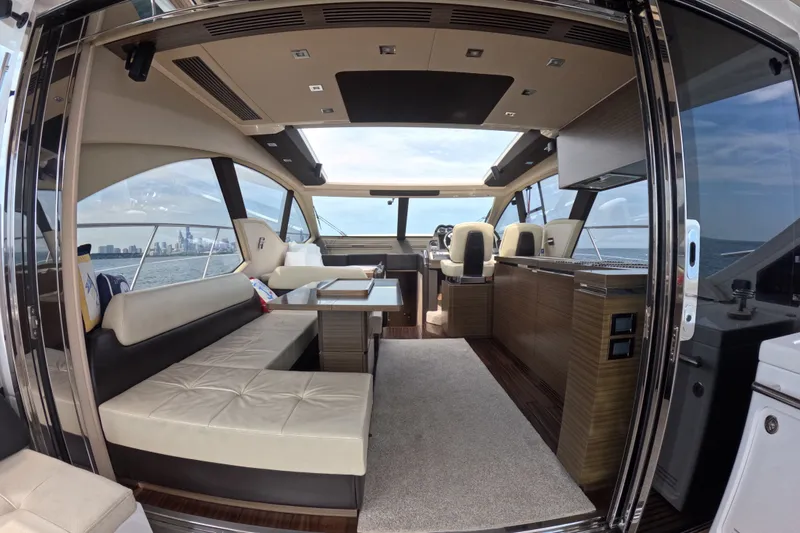 Slide: The Image of Luxurious interior of a 2016 Azimut 55S yacht with elegant seating and panoramic views. - 38