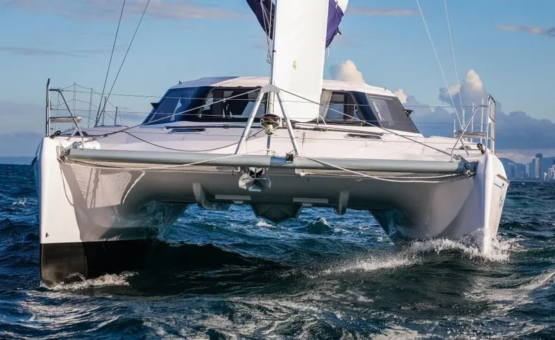 Slide: The Image of 2024 Seawind 1260 Owners Version catamaran sailing on open water. - 12