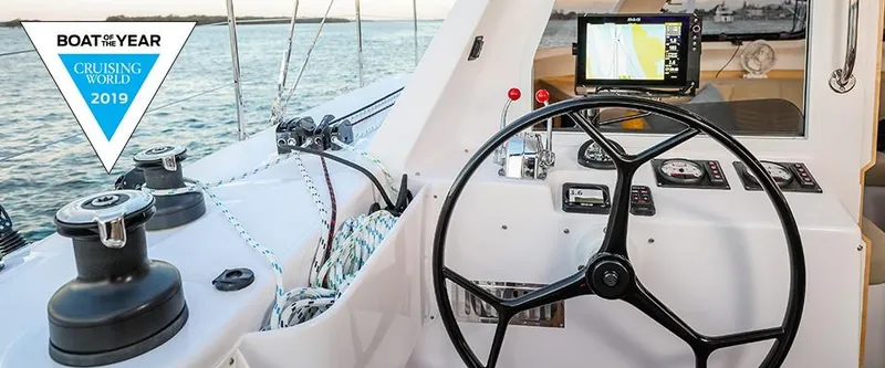 Slide: The Image of Seawind 1260 Owners Version 2024 cockpit with navigation equipment and Boat of the Year award. - 16