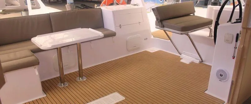 Slide: The Image of 2024 Seawind 1260 Owners Version yacht cockpit with seating and table. - 20