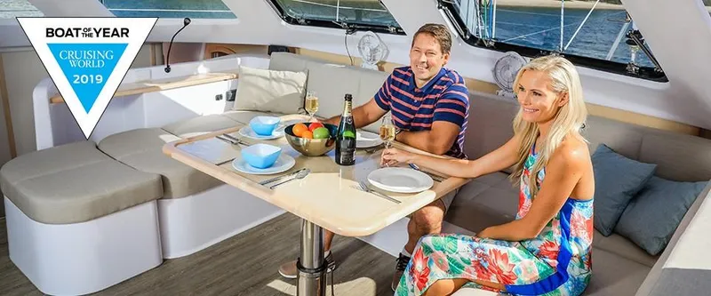 Slide: The Image of Couple dining on Seawind 1260 Owners Version catamaran, 2024 model, awarded Boat of the Year 2019. - 24