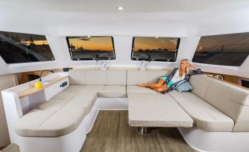 Slide: The Image of Interior of 2024 Seawind 1260 Owners Version catamaran with spacious seating area. - 27