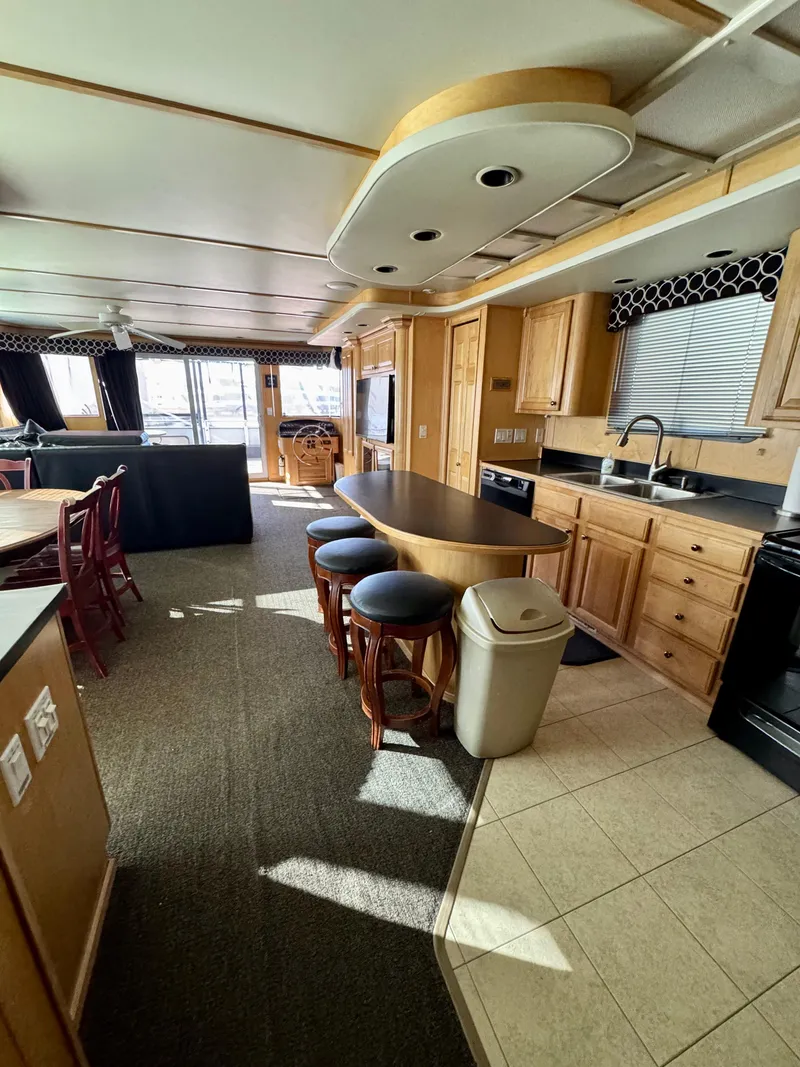 Slide: The Image of Interior of 2006 Sumerset Seas The Day Trip 4 houseboat with modern kitchen and seating area. - 16
