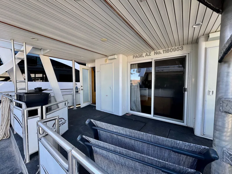 Slide: The Image of 2006 Sumerset Seas The Day Trip 4 houseboat deck with seating and sliding glass doors. - 39