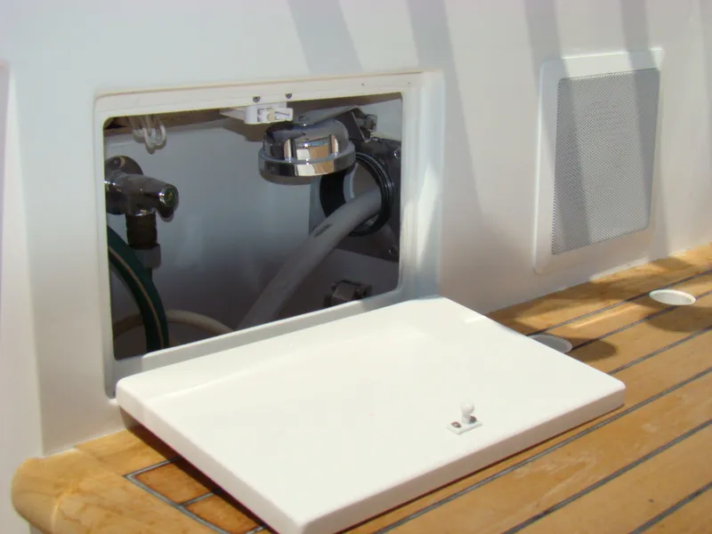 Slide: The Image of Access panel on the 2024 Jersey Cape 47 Custom Hardtop boat. - 30