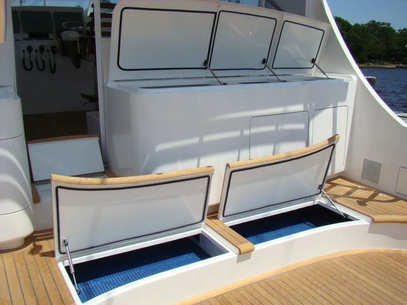 Slide: The Image of 2024 Jersey Cape 47 Custom Hardtop boat with open storage compartments. - 31