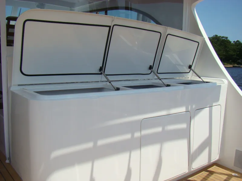 Slide: The Image of 2024 Jersey Cape 47 Custom Hardtop boat with open storage compartments. - 34