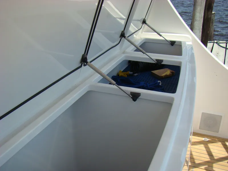 Slide: The Image of Storage compartments on the 2024 Jersey Cape 47 Custom Hardtop boat. - 35