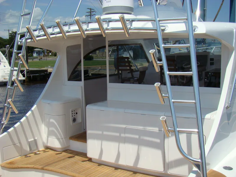 Slide: The Image of 2024 Jersey Cape 47 Custom Hardtop yacht with sleek design and fishing rod holders. - 37