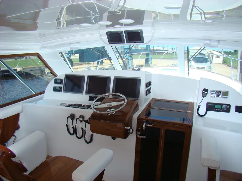 Slide: The Image of 2024 Jersey Cape 47 Custom Hardtop helm with advanced navigation systems. - 5