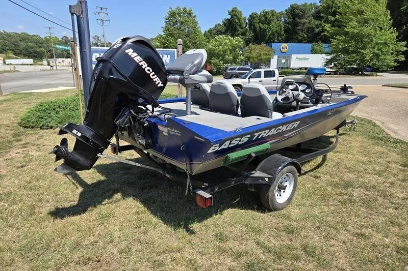 Slide: The Image of 2011 Tracker Pro Team 175 TF bass boat with Mercury engine on trailer. - 16