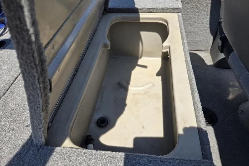 Slide: The Image of Open storage compartment in 2011 Tracker Pro Team 175 TF boat. - 3