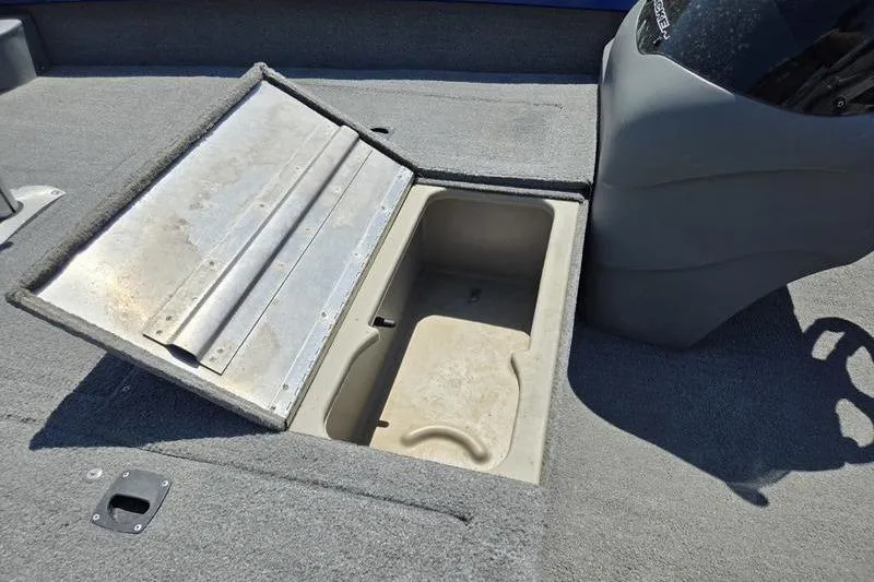 Slide: The Image of Open storage compartment on 2011 Tracker Pro Team 175 TF boat deck. - 10