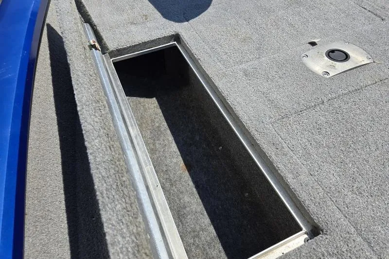 Slide: The Image of 2011 Tracker Pro Team 175 TF boat storage compartment, open and empty. - 11