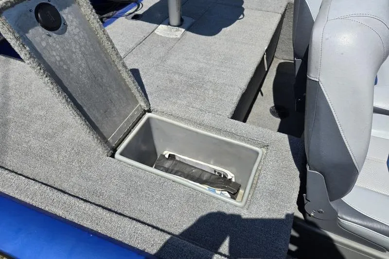 Slide: The Image of 2011 Tracker Pro Team 175 TF boat interior with open storage compartment. - 2