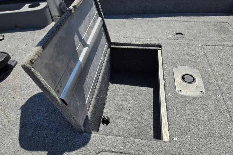 Slide: The Image of Open storage compartment on 2011 Tracker Pro Team 175 TF boat deck. - 6