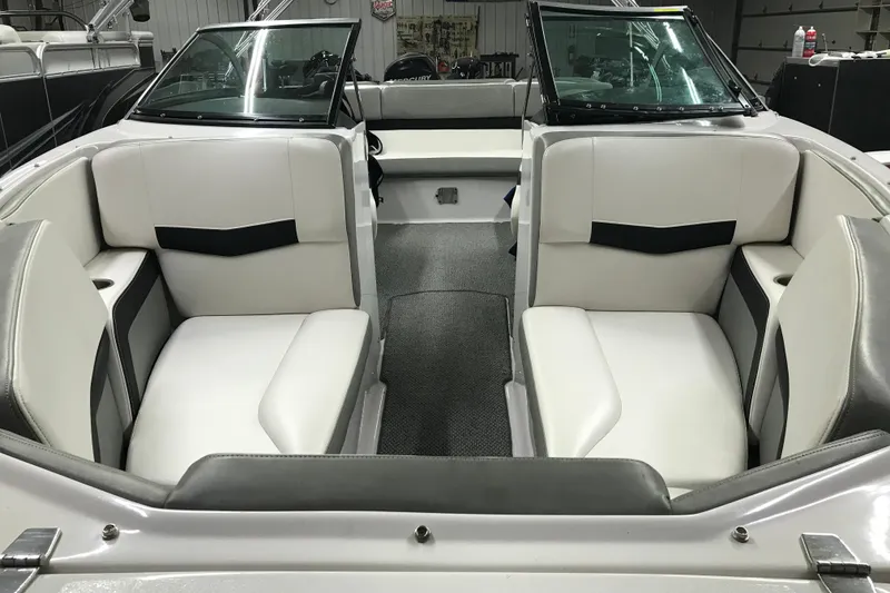 Slide: The Image of Interior of 2015 Four Winns H230 boat with white seating and modern design. - 24
