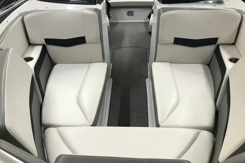 Slide: The Image of 2015 Four Winns H230 boat interior with white and gray seating. - 26