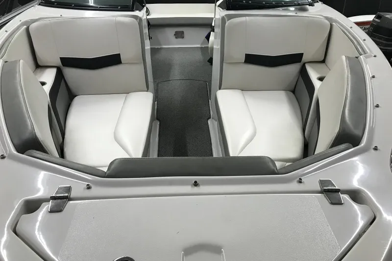 Slide: The Image of Interior of 2015 Four Winns H230 boat with white and gray seating. - 28