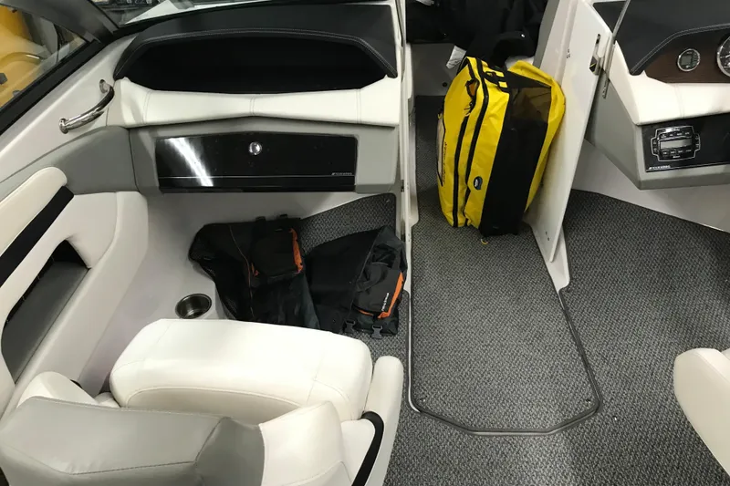 Slide: The Image of Interior of 2015 Four Winns H230 boat with seating and storage compartments. - 34