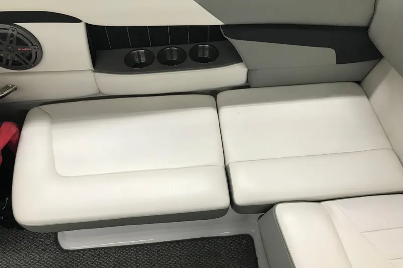 Slide: The Image of Interior seating of 2015 Four Winns H230 boat with cup holders and speaker. - 36