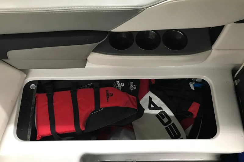 Slide: The Image of Storage compartment in 2015 Four Winns H230 boat with life jackets. - 39