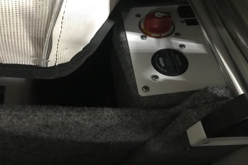 Slide: The Image of Interior view of a 2015 Four Winns H230 boat showing control panel and upholstery. - 40