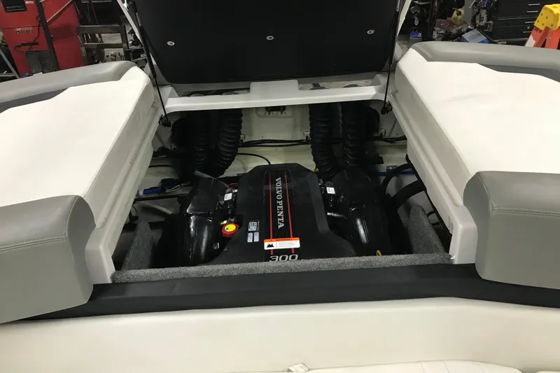 Slide: The Image of 2015 Four Winns H230 boat engine compartment with visible engine components. - 42